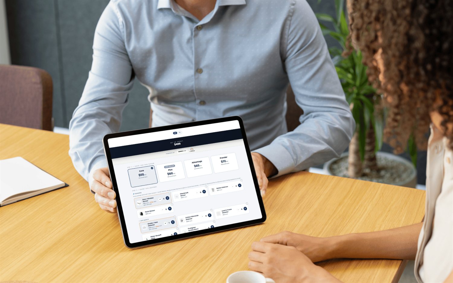 FieldStacker doorstep quote builder on a tablet with plans, equipment and a live out-of-pocket total